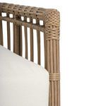 Detail of woven rattan vertical and horizontal binders near cushion edge