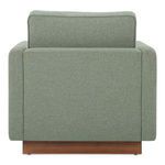 Back view of Vernon Accent Chair showing flat back upholstery and wooden plinth base