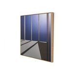 Side angled view showing the vertical grain white oak floater frame depth and texture around the photograph
