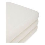 Detail of sofa arm with sharp, clean edge and smooth off-white upholstery texture