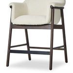 Close-up showing wood leg detail and upholstery joining point close to the footrest