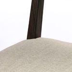 Macro shot of tufted stone fabric upholstery with subtle woven texture