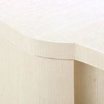 Close-up detail of the serpentine top edge and rounded corner highlighting the side table’s ribbed wood texture