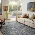 Anniston Lagoon Natural Rug in bright living room under couch and near large window with natural light
