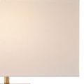 Detailed view of cream rectangular lamp shade and top of brass metal frame