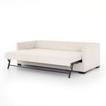 Close-up on sofa bed leg and base showing sturdy construction and black feet