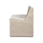 Side profile of woven rattan banquette highlighting curved back and fabric seat cushion