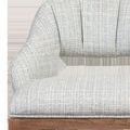 Close-up showing textured greenlight powder fabric upholstery with vertical channel stitching on backrest