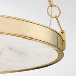 Close-up of bracket connecting aged brass ring to paperclip chain link