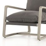 Bottom section of chair showing base frame's angular lines supporting the cushioned seat