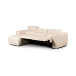 Sectional with left seat reclined and headrest raised, showing metal reclining mechanism
