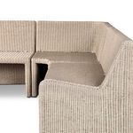 Separate view of two smaller rattan bench sections detached from corner unit