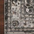 Close view of Estelle rug border on wood floor highlighting pattern detail and texture