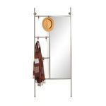 Mirror styled with tan hat and brown striped scarf hanging from leather hooks in white space