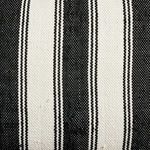 Close-up of woven texture and black white stripes on cabana outdoor pillow