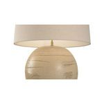 Moriko Lamp from a lower front angle emphasizing the textured sandy clay base and wide lampshade