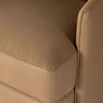 Detail of armrest and back cushion seam showing clean stitching and leather quality