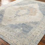 Close-up angle showing detailed pattern and color blending of blue and beige on the Luca rug