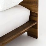 Headboard to side rail joint close-up showing solid oak beam nestled into frame