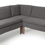 Close-up of inside corner junction emphasizing cushions and wood legs