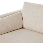 Detailed view of seat cushions and arm bolster pillow on cream basketweave fabric
