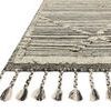 Close-up angled view focusing on braided fringe and edge details of the Iman Ivory/Charcoal Rug