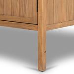Close-up of bottom corner leg of Knightdale Brown Wooden Cabinet showing wood texture and finish