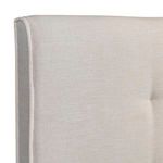 Side view showing flange detail on soft beige upholstery along headboard edge