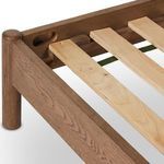 Side profile with mattress showing low smoked oak frame and ivory headboard