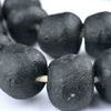 Close-up focused on bead surfaces revealing rough matte finish and slight natural chip marks