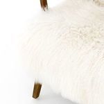Three-quarter angle displaying clean lines of drifted oak legs and cream shaggy fur seating