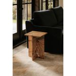 Blair Accent Table positioned next to black sofa on patterned rug in natural light room setting