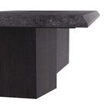 Close-up side view highlighting marble top edge thickness and textured ebony mango wood pedestal