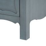 Close-up of lower leg of Sara Cabinet showcasing scalloped apron and wood texture