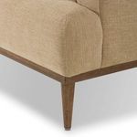 Close-up on tapered wood leg and rounded wood frame corner of Ethel Sofa