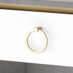 Close-up of gold round-shaped drawer pull variant on white drawer front