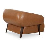Back three-quarter view of Devlin chair highlighting rounded leather upholstery and ash legs