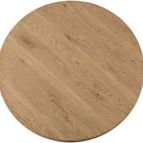 Top-down close-up of round cocktail table showing natural wood grain patterns and knots
