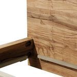 Close-up of the headboard corner and attachment to the side rail showing large joint hardware