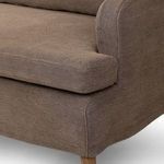Tight close-up on seat cushion corner and fabric texture