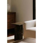 Blair Accent Table beside sofa in living room, hardwood floor and wooden cabinet in background