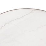 Detailed macro shot capturing delicate veining patterns on the marble tabletop