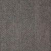 Detailed close-up of geometric triangular pattern and textured weave on Phoenix charcoal gray rug
