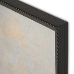Close-up angled view of black wooden frame with decorative notched border on painting