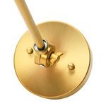 Close-up of brass base with mounting plate and adjustable arm joint