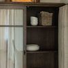Hallway with Finley Cabinet showcasing shown partially open front door and copper decorative container