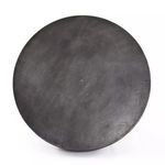 Top view showing smooth, slightly textured aged grey surface of the round coffee table.