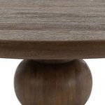 Close-up side view focusing on the thickness of the tabletop and rounded central pedestal shape