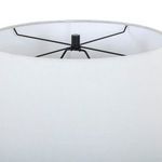 Top view inside the white fabric lamp shade revealing black metal support frame and finial