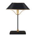 Front view of lamp with smooth black shade and gold trim illuminated by studio lighting